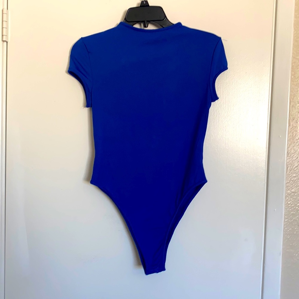 Never worn blue high neck body suit